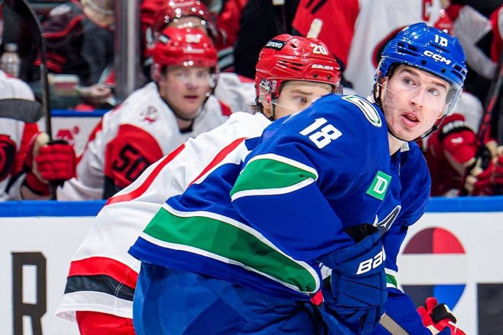 Vancouver Canucks forward Drew O&rsquo;Connor (18) is watched by Carolina Hurricanes forward Sebastian Aho during NHL action Wednesday, March 4, 2026 at Rogers Arena in Vancouver. (https://x.com/Canucks)